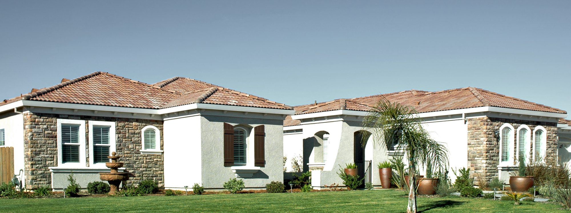 Single-story stucco ranch homes on a Central Valley street