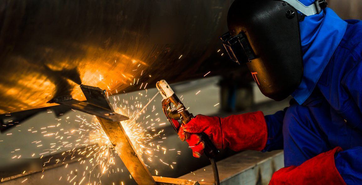 Welder joining steel, sparks coming off the workpiece